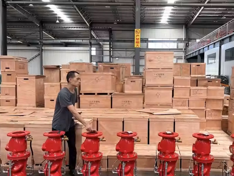 Packed cartons and fire equipment prepared in a factory packing area